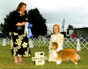Gabby winning GROUP FIRST, under Breeder Judge Laura Thompson.
