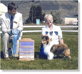 Lexi is pictured at 8 months old, winning BEST PUPPY IN GROUP!